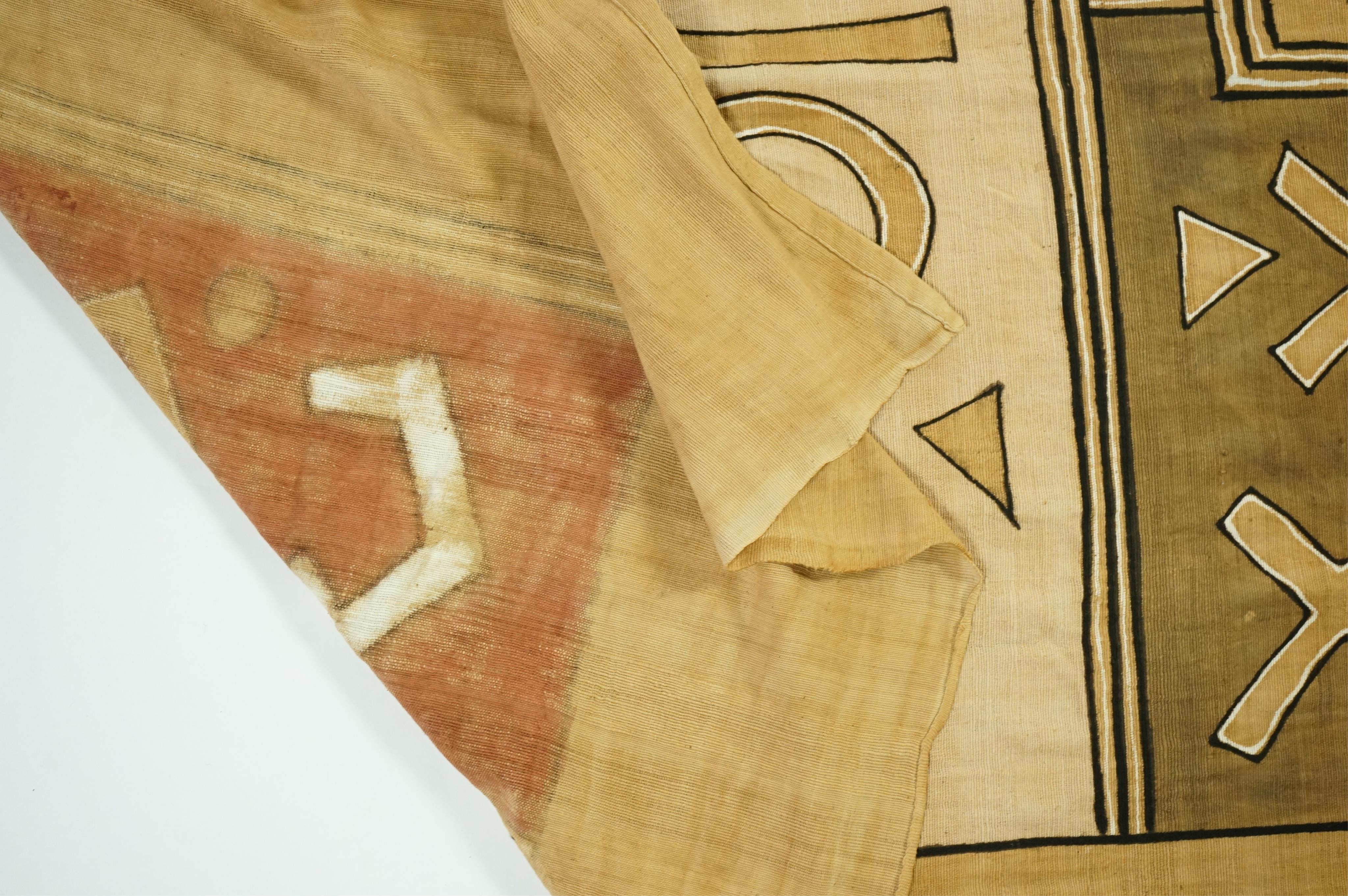 A collection of five 20th century African Congo hand woven and embroidered raffia palm leaf runners and mats, together with a later large printed hanging. 260cm x 138cm. Condition - one smaller mat has a hole in the weav